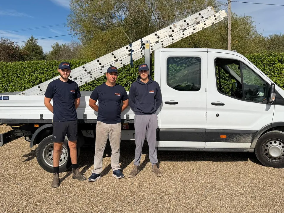 The Amber Roofing Specialist team with their truck